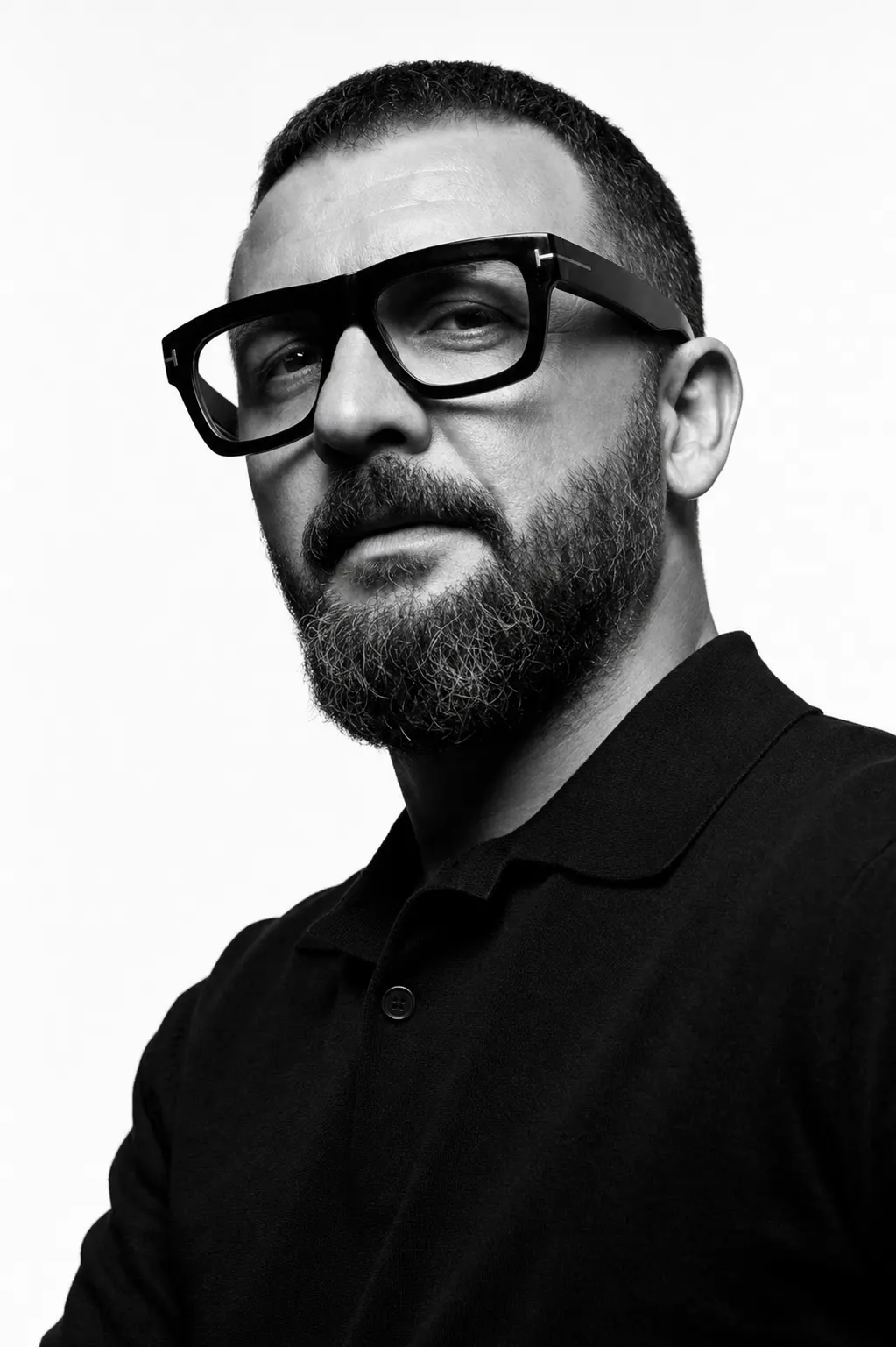 Selman Yılmaz — seated editorial portrait